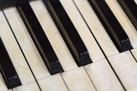 Close up detailed view of historical old piano with white and black buttons.の写真素材