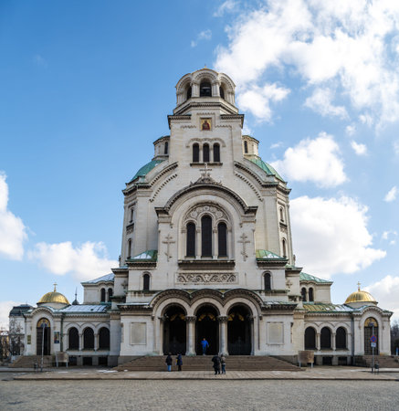 SOFIA, BULGARIA - FEBRUARY 7, 2016 : General view of famous Bulgarian Orthodox church of Alexander Nevsky Cathedral built in 1882 in Sofia, Bulgaria, on cloudy blue sky background.のeditorial素材