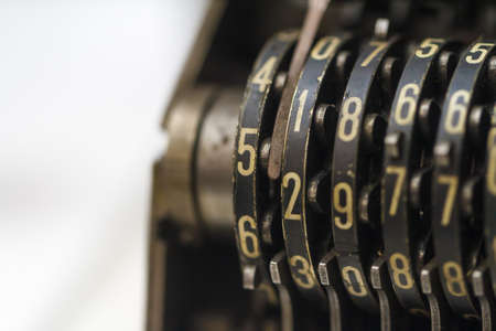 Close up detailed view of historical old calculator with small iron buttons.の写真素材