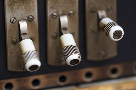 Close up detailed view of historical old telegram with small iron bottons.の写真素材