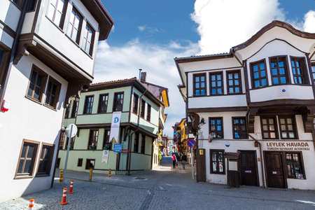 ESKISEHIR, TURKEY - APRIL 17, 2016 : General view of historical old colorful Odunpazari houses and pathway on blue sky background.のeditorial素材