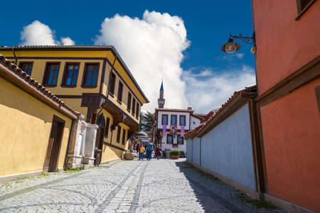 ESKISEHIR, TURKEY - APRIL 17, 2016 : General view of historical old colorful Odunpazari houses and pathway on blue sky background.のeditorial素材