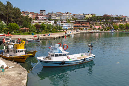 SINOP, TURKEY - MAY 14, 2016 : View of small fishing boats on coastline of Gerze Port in Sinop, on blue sky background.のeditorial素材