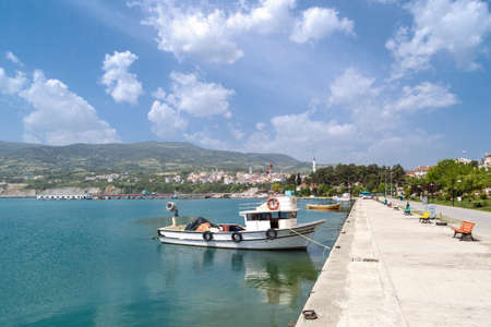 SINOP, TURKEY - MAY 14, 2016 : View of small fishing boats on coastline of Gerze Port in Sinop, on blue sky background.のeditorial素材