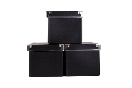 Close up view of three black cardboard box isolated on white background.