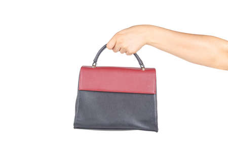 Woman hand holding business handbag, isolated on white background.の写真素材