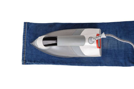 Iron and cloth, isolated on white background.の写真素材