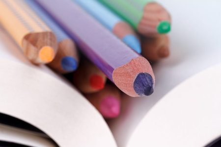 Close up detailed view of multicolored crayon pencils on paper.の写真素材