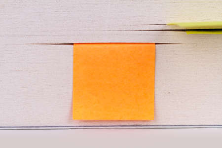 Close up detailed book notebook page view with sticky note paper on it.の写真素材