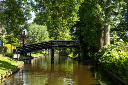 OVERIJSSEL, NETHERLANDS - JULY 4, 2016 : Landscape view of famous houses with thatched roofs around canals. Giethoorn is very popular village.のeditorial素材
