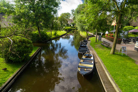 OVERIJSSEL, NETHERLANDS - JULY 4, 2016 : View of small sailboats in canals around trees in farm area. Giethoorn is very popular village.のeditorial素材