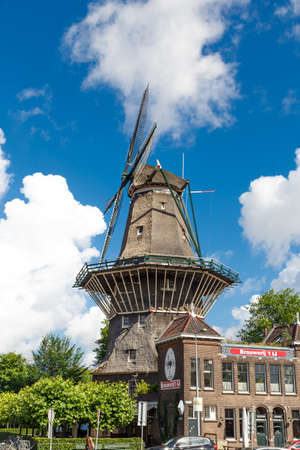 AMSTERDAM, NETHERLANDS - JULY 3, 2016 : View of famous historical De Gooyer Windmill on cloudy sky. Amsterdam is popular with windmills.のeditorial素材
