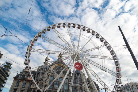 ANTWERP, BELGIUM - JULY 5, 2016 : Exterior view of the Central Train Station of Antwerp with ferris wheel. Antwerp is the capital city in the region of Flanders.のeditorial素材