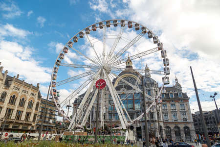 ANTWERP, BELGIUM - JULY 5, 2016 : Exterior view of the Central Train Station of Antwerp with ferris wheel. Antwerp is the capital city in the region of Flanders.のeditorial素材
