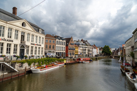 GENT, BELGIUM - JULY 6, 2016 : View of Graslei and Korenlei between medieval architecture buildings...