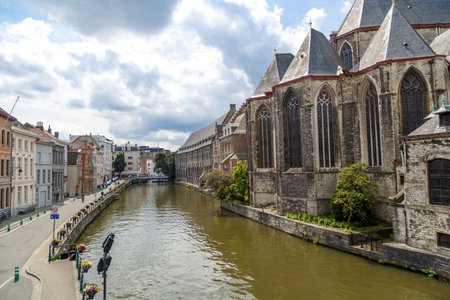 GENT, BELGIUM - JULY 6, 2016 : View of St. Michael's Church from St. Michael's Bridge on Leie River...