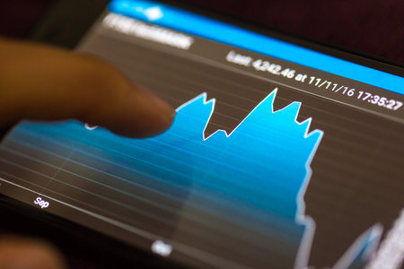 Business and trading finance contept. Stock exchange market chart view on smart phone screen.