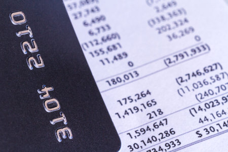 Close up detailed view of credit card and payment and cost lists with finance concept.