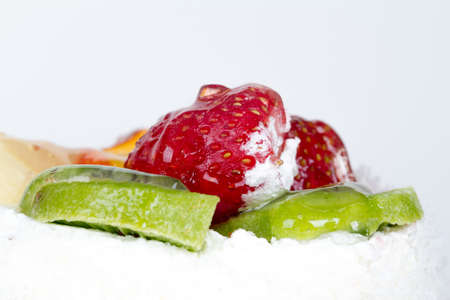 Close up detailed view of fresh strawberry and kiwi, isolated on white background.の写真素材