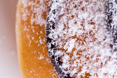 Close up detailed view of yummy donut with powdered sugar on.