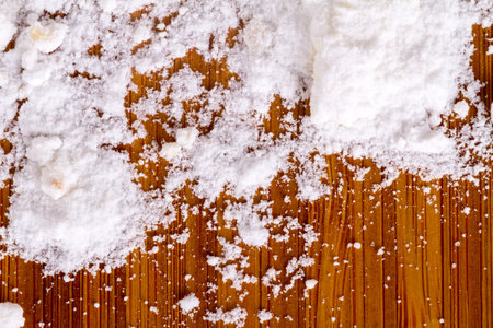 Close up view of cookies with powdered sugar, served on wooden background.