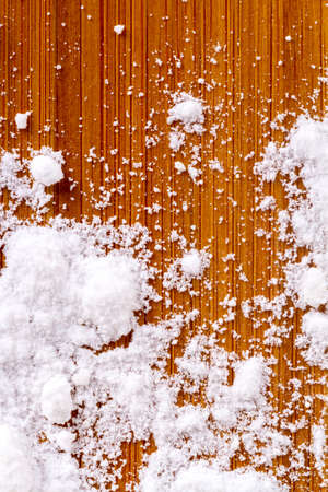Close up view of cookies with powdered sugar, served on wooden background.の写真素材