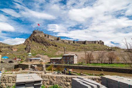 KARS, TURKEY - MAY 07, 2017 : General view of Kars river with the scene of historical Kars Castle on cloudy sky background in Kars, Eastern Anatolia Region Turkey.のeditorial素材