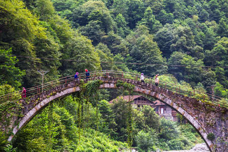 RIZE, TURKEY - AUGUST 15, 2016 : General landscape view of historical high stone bridges on Firtina river in Rize Camlihemsin area on foggy sky background.のeditorial素材