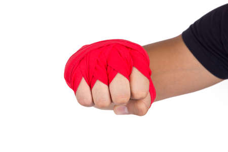Close up detailed view of mixed martial arts athlete man hand with red boxing wraps, ready for fighting, exercising and strong, isolated on white background.の写真素材