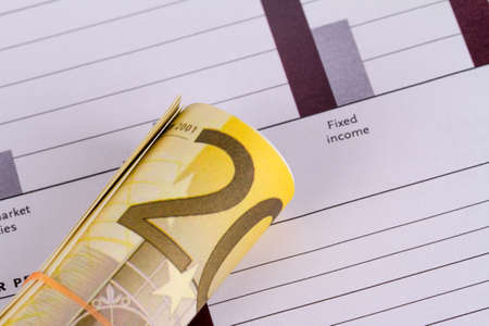 Finance concept, euro banknotes with bar graph chart background.の写真素材