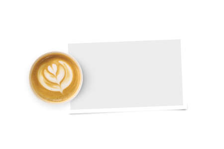 Top view of flower sign designed cup of coffee with white mock up cardboard, copy space frame on white background.の写真素材