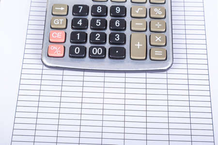 Finance and business concept, calculator on blank report paper.の写真素材