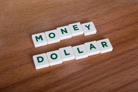 Money euro word with letters and on wooden background.の写真素材