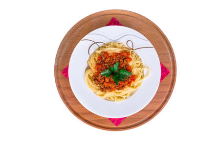Top view of plate of spaghetti pasta with tomato bolognese sauce, isolated on white background.の写真素材