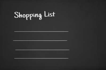 Illustrative white shopping list on consumer concept,, on black chalk board.の写真素材