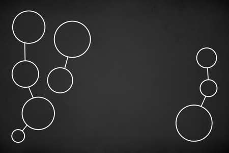 Illustrative white circles connected each other in groups network, on black chalk board background.の写真素材