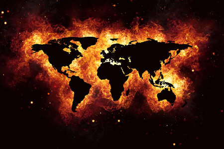Realistic world map burning fire flames with sparks and smoke, explosion effect on black background.の写真素材