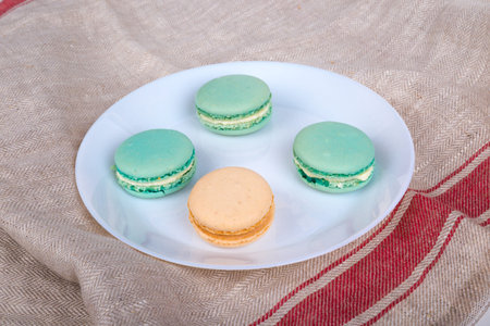 Detailed view of colorful tasty and yummy macarons served in plate.の写真素材