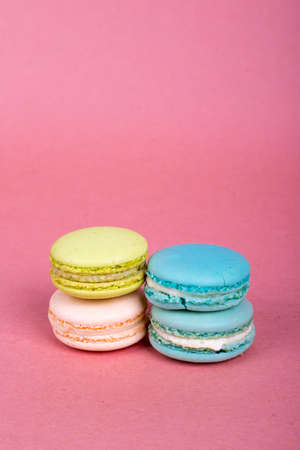 View of colorful tasty and yummy macarons served in pink concept background.の写真素材