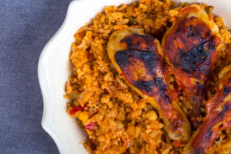 Top view of bulgur pilaf made from cracked wheat with grilled chicken, on dark background.の写真素材