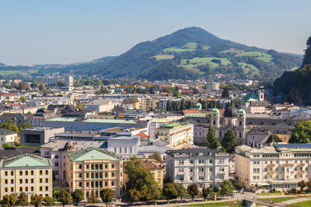 SALZBURG, AUSTRIA - SEPTEMBER 13, 2016 : Cityscape view of historic Salzburg city in Austria, old town city center and Salzach river on blue sky background.のeditorial素材