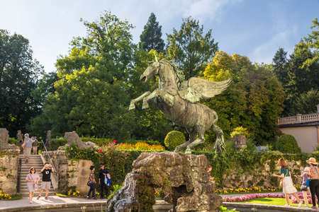 SALZBURG, AUSTRIA - SEPTEMBER 13, 2016 : Colorful beautiful garden view of Mirabell Palace with decorative pools and sculptures. Mirabell Palace is one of the most popular tourist attractions in Salzburg.のeditorial素材