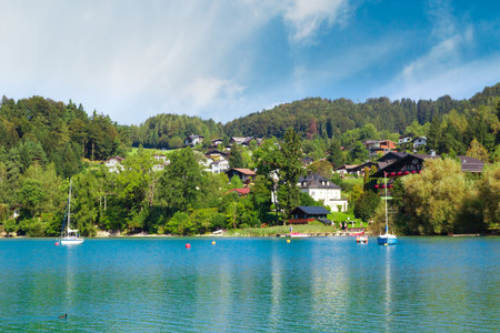 FUSCHL AM SEE, AUSTRIA - SEPTEMBER 14, 2016 : Landscape view of Lake Fuschlsee, Austrian Alpine mountains in touristic town of Salzburg Fuschl am See.のeditorial素材