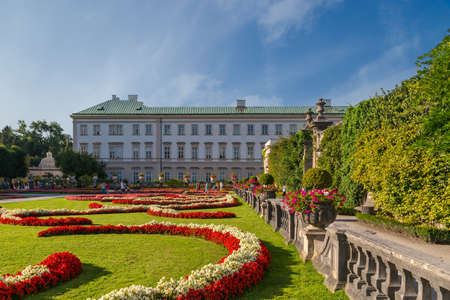 SALZBURG, AUSTRIA - SEPTEMBER 13, 2016 : Colorful beautiful garden view of Mirabell Palace with decorative pools and sculptures. Mirabell Palace is one of the most popular tourist attractions in Salzburg.のeditorial素材