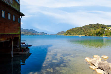 FUSCHL AM SEE, AUSTRIA - SEPTEMBER 14, 2016 : Landscape view of Lake Fuschlsee, Austrian Alpine mountains in touristic town of Salzburg Fuschl am See.のeditorial素材