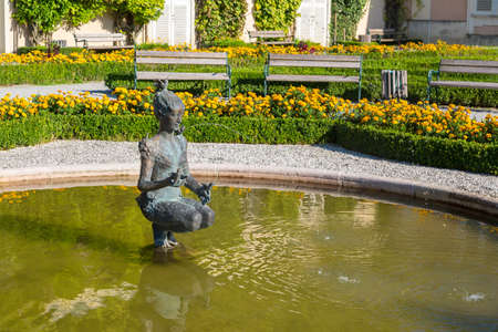 SALZBURG, AUSTRIA - SEPTEMBER 13, 2016 : Colorful beautiful garden view of Mirabell Palace with decorative pools and sculptures. Mirabell Palace is one of the most popular tourist attractions in Salzburg.のeditorial素材