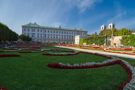 SALZBURG, AUSTRIA - SEPTEMBER 13, 2016 : Colorful beautiful garden view of Mirabell Palace with decorative pools and sculptures. Mirabell Palace is one of the most popular tourist attractions in Salzburg.のeditorial素材