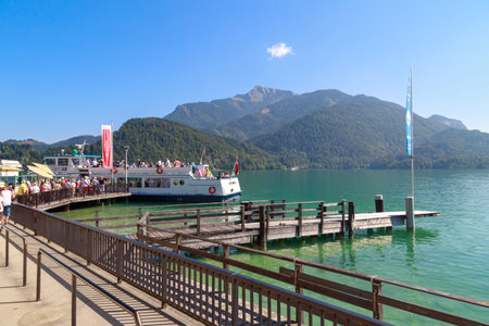 SALZBURG, AUSTRIA - SEPTEMBER 14, 2016 : Landscape view of St Gilgen village in Salzburg Austria. St Gilgen is by Lake Wolfgang and Alp Mountains with scenic view on blue sky background.のeditorial素材