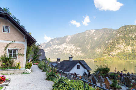HALLSTATT, AUSTRIA - SEPTEMBER 14, 2016 : Landscape Hallstatt village view from Beinhaus Ossuary garden, also known as bone house, with historical iconic mountain houses among high Alp Mountains.のeditorial素材