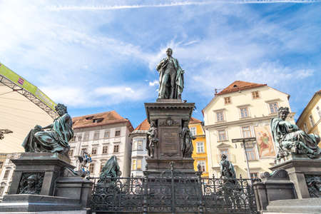 GRAZ, AUSTRIA - SEPTEMBER 16, 2016 : Exterior view of Hauptplatz with sculptures. Main square of Graz historical city in Styria on cloudy sky.のeditorial素材